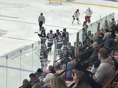 Puck battle along the boards